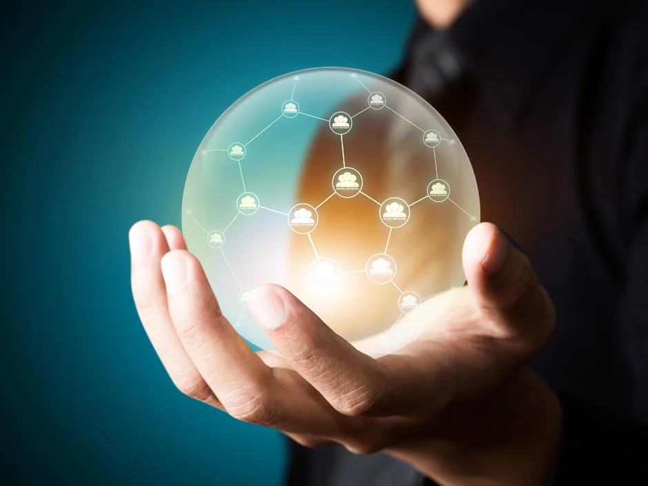 A hand holding a glowing globe of connected technology nodes